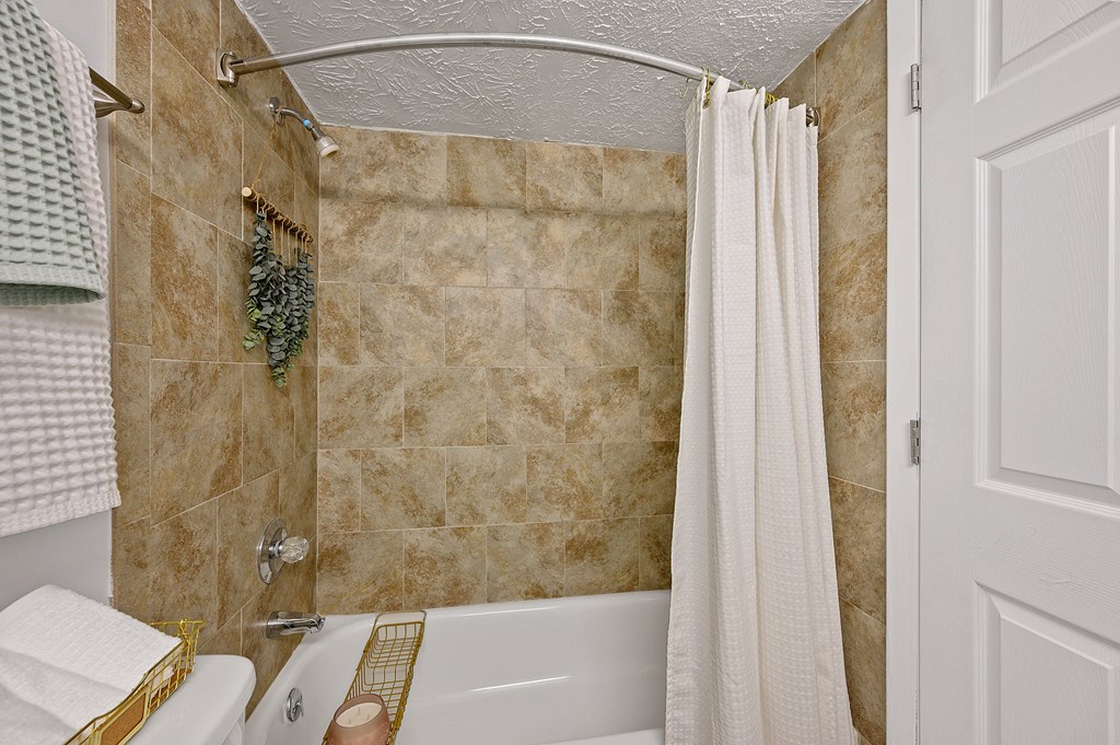Bathroom with a shower and a tub and a shower curtain at Wrights Point,  41011