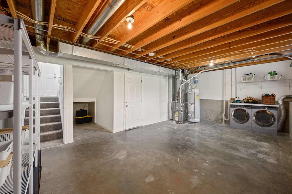 a laundry room with a washer and dryer