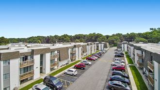 an aerial view of an apartment complex with cars parked on the side of the road - Photo Gallery 5