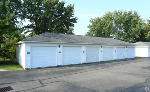Six car garages with white doors at Sharon Glen Apartments, Columbus, OH 43229
