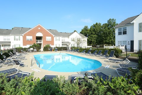 Outdoor swimming pool with lounge chairs at Sharon Glen Apartments, Ohio, 43229