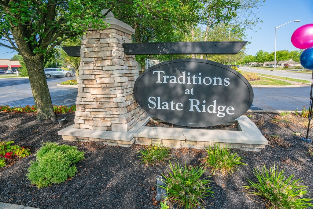 a sign that says traditions at slate ridge on the side of a street at Slate Ridge, Reynoldsburg, OH 43068