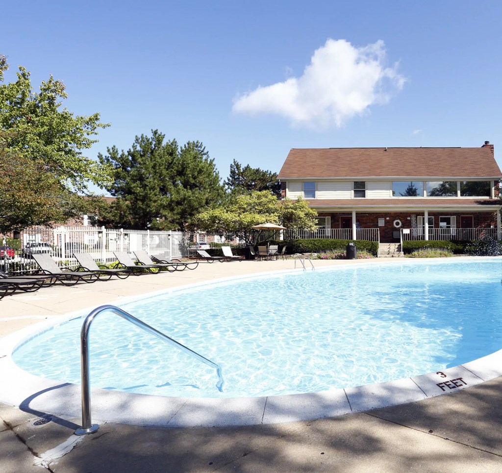 A pool with a ladder in the middle of it.