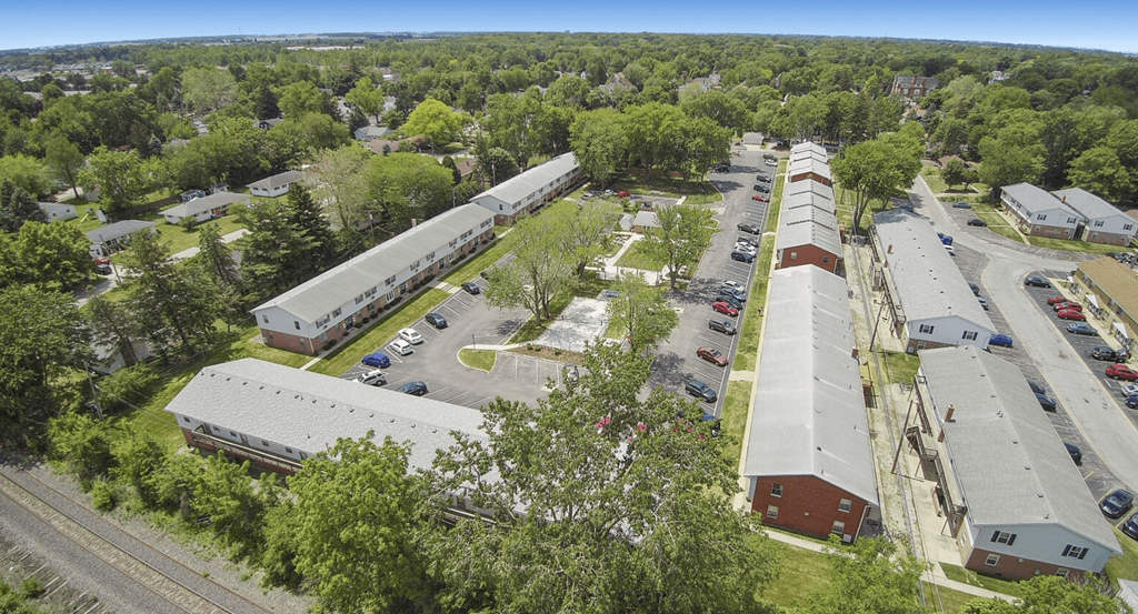 an aerial view of a city with buildings and trees