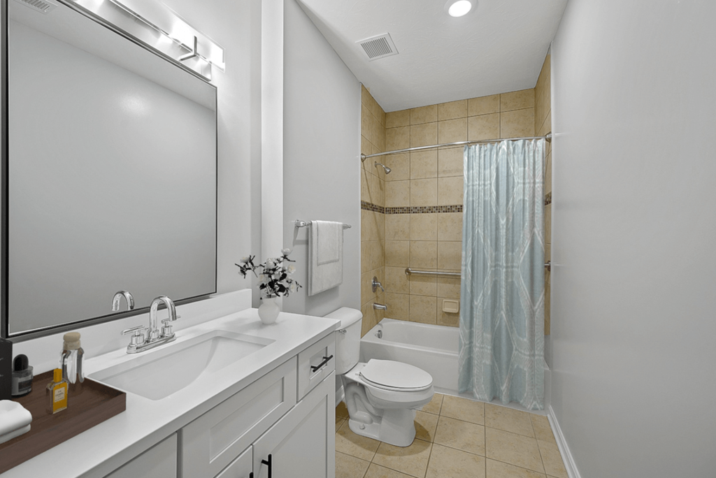 a bathroom with a sink toilet and a shower at Monmouth Row Apartments, Newport, Kentucky