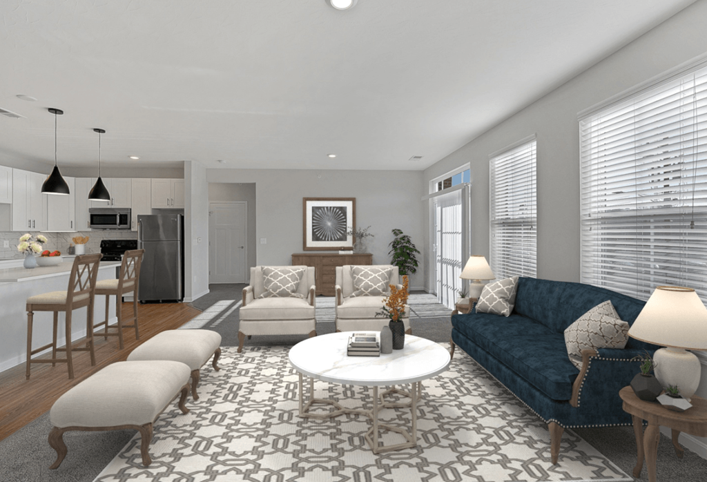 a living room with a blue couch and a white coffee table at Monmouth Row Apartments, Newport, KY