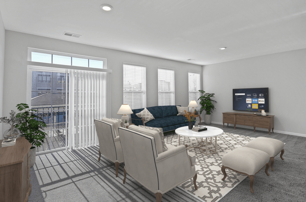 a living room with a couch and chairs and a tv at Monmouth Row Apartments, Newport, Kentucky