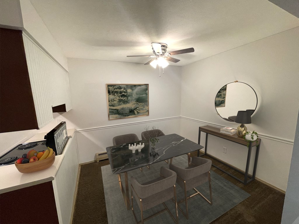 a dining room with a table and chairs