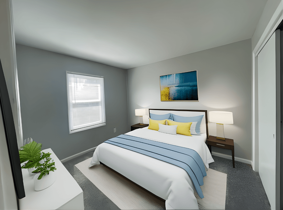 a bedroom with a white bed and blue and yellow pillows