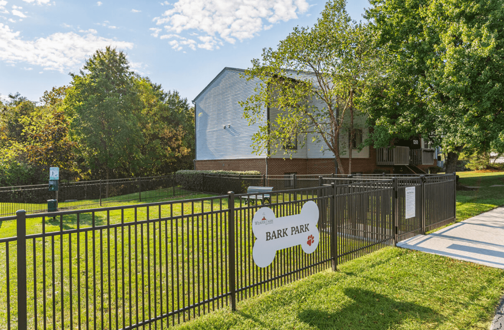 a yard with a fence and a sign that reads bear park at Weaver Farm, Florence, 41042