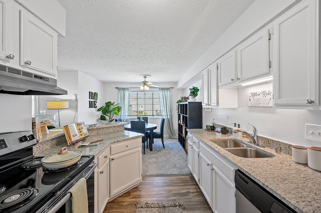 Spacious kitchen with granite counter tops and a dining room with a table and chairs Spacious kitchen with granite counter tops and a dining room with a table and chairs at Wrights Point, 41011