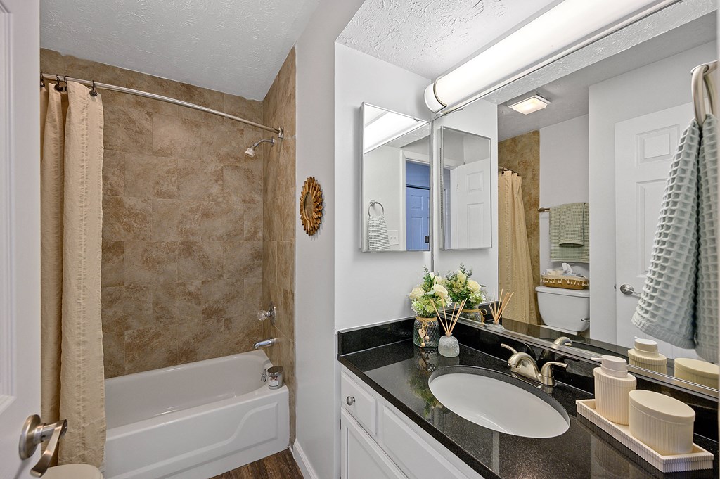 Bathroom with a shower and a sink and a mirror at Wrights Point, Ft Wright