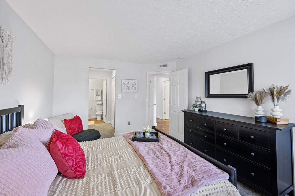 Bedroom with a bed and a dresser and a mirror at Wrights Point, Ft Wright, KY