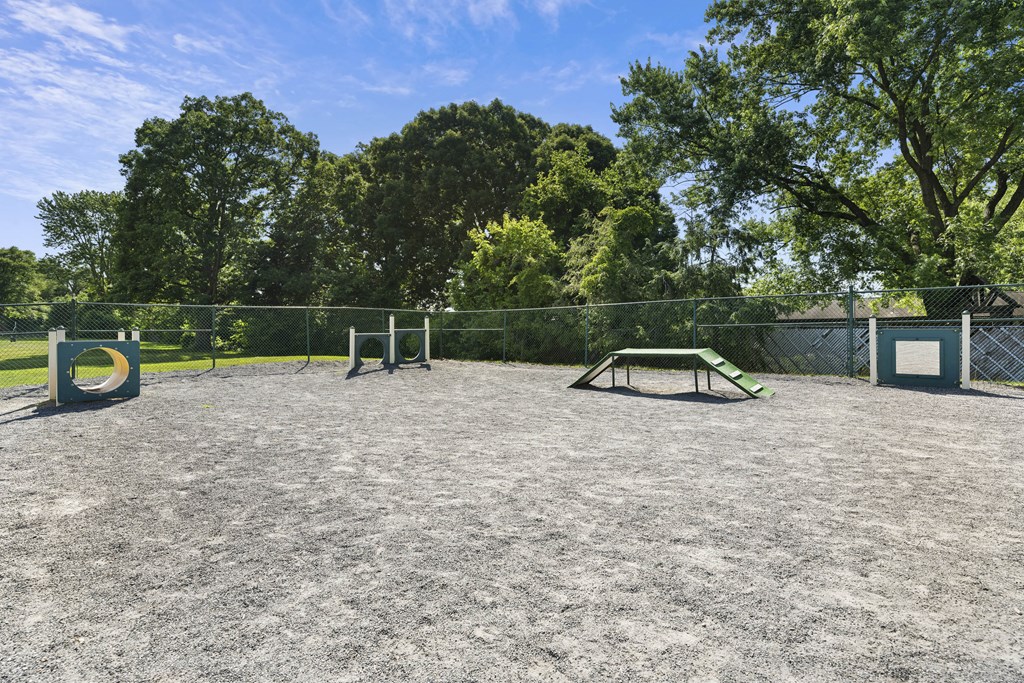 A park with a picnic table and a fence at Rose Hill Apartments, Alexandria, VA