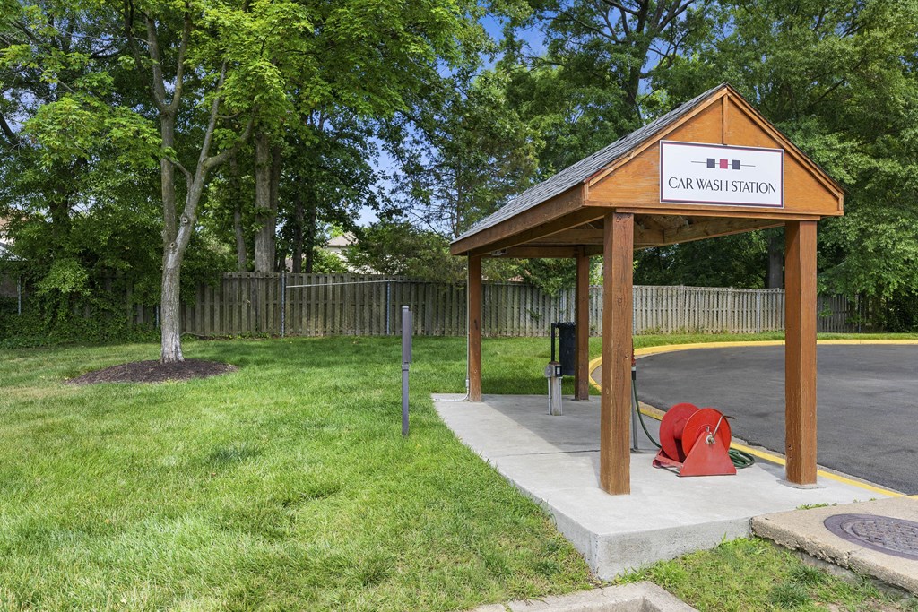 A car wash station with a wooden roof and a sign on it at Rose Hill Apartments, Alexandria, VA, 22310