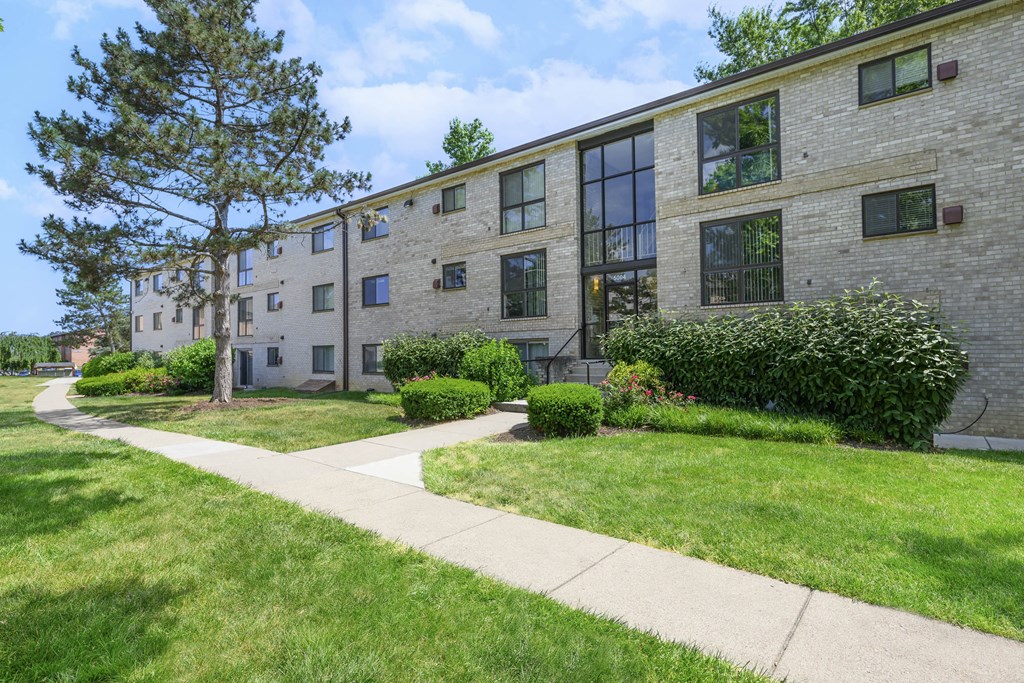 A building with a green lawn in front at Rose Hill Apartments, Virginia