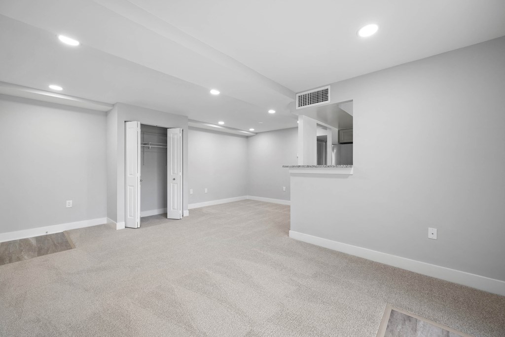 A spacious room with a carpeted floor and a doorway leading to another room at Rose Hill Apartments, Virginia, 22310