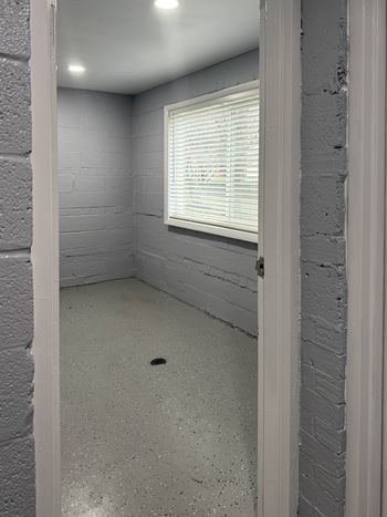 A room with a window and a door at Rose Hill Apartments, Alexandria, Virginia