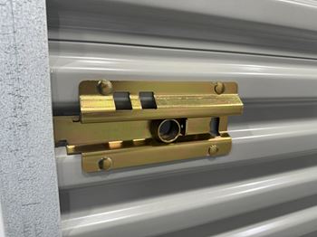 A close-up of a latch mechanism on a piece of equipment at Rose Hill Apartments, Alexandria, VA, 22310