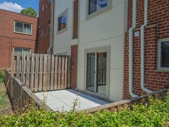 Outdoor patio area connected with apartment unit