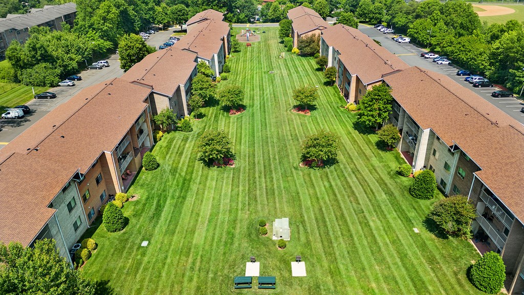 an aerial view of an apartment complex with a green lawn at Gainsborough Court Apartments, Fairfax