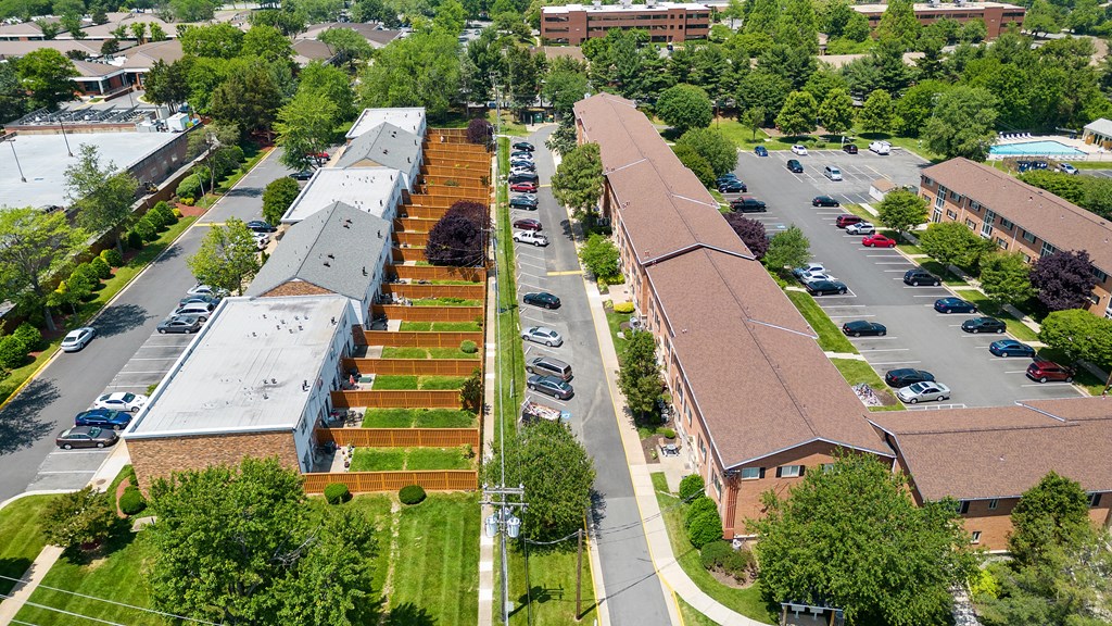 an aerial view of a church and a parking lot at Gainsborough Court Apartments, Fairfax, Virginia