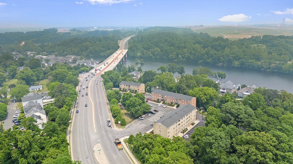 an aerial view of a highway and a bridge over a river