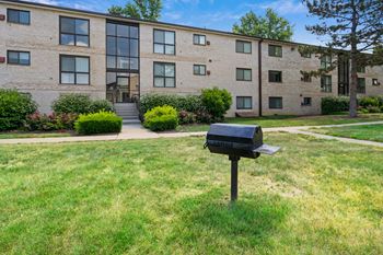 an apartment building with a mailbox in front of it at Rose Hill Apartments, Alexandria