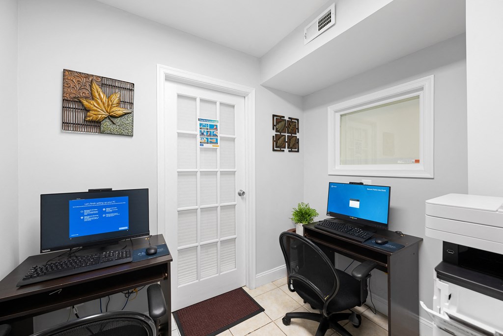 a home office with two computers and a printer at Gainsborough Court Apartments, Fairfax, VA, 22030
