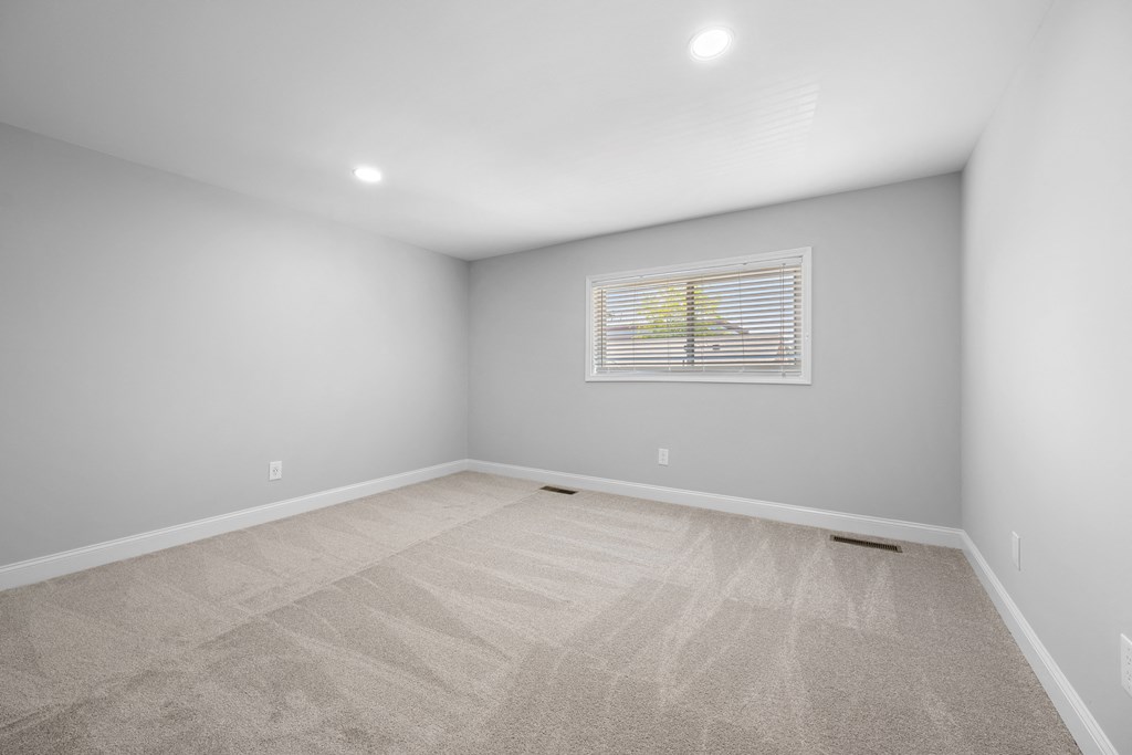 an empty room with white walls and a window on the wall at Gainsborough Court Apartments, Fairfax, 22030