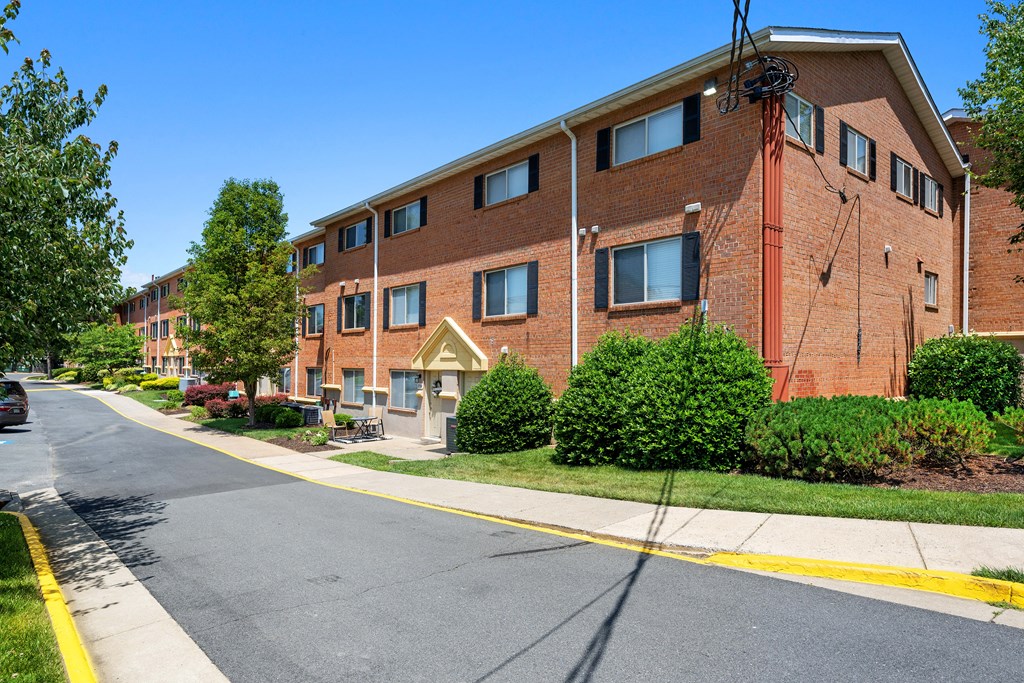 a brick apartment building with a street in front of it at Gainsborough Court Apartments, Fairfax