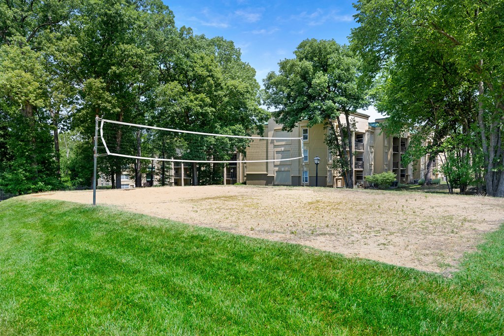 the volleyball court is in front of the building at Stuart Woods* Apartments, Herndon, Virginia