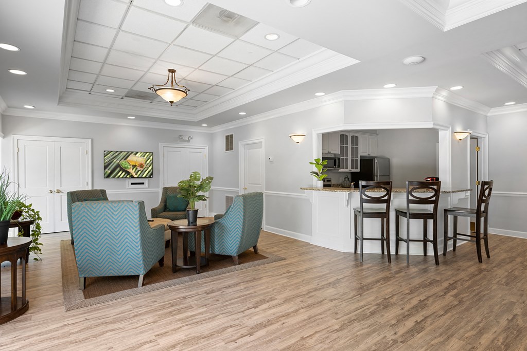a living room with a dining area and a kitchen at Stuart Woods* Apartments, Herndon, VA, 20170