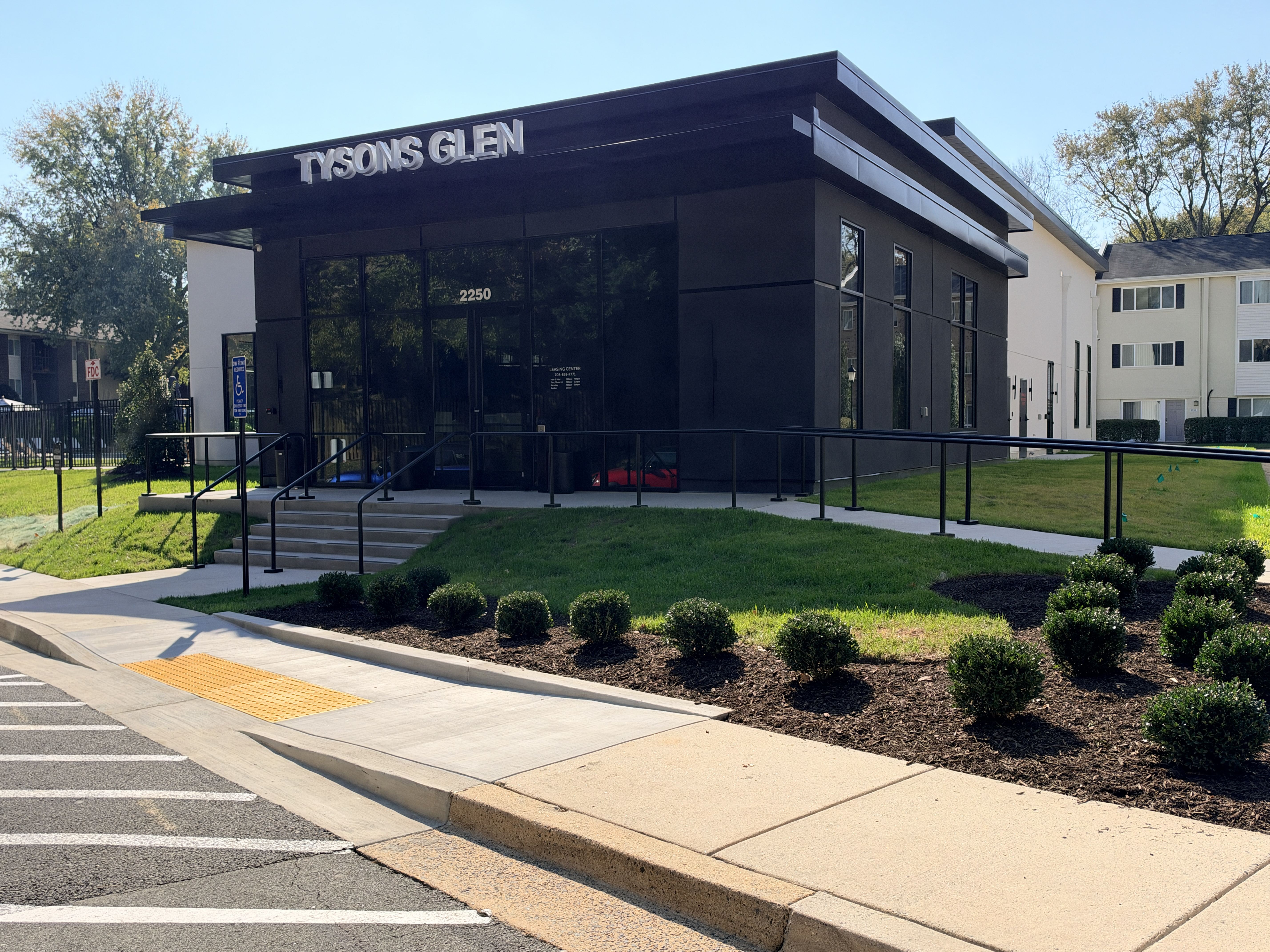 A Tysons Glen building with a parking lot in front.