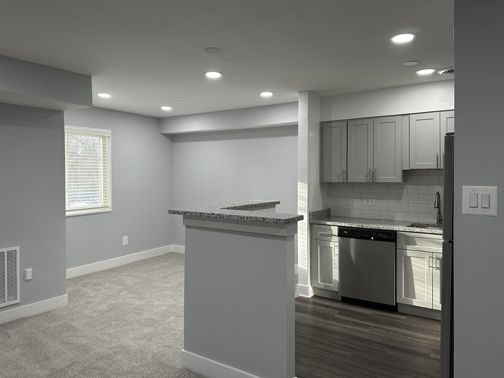 A kitchen with a dishwasher and a countertop at Tysons Glen Apartments and Townhomes, Virginia
