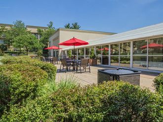 Outdoor Lounge With Umbrella Shades at Stuart Woods, Herndon, Virginia