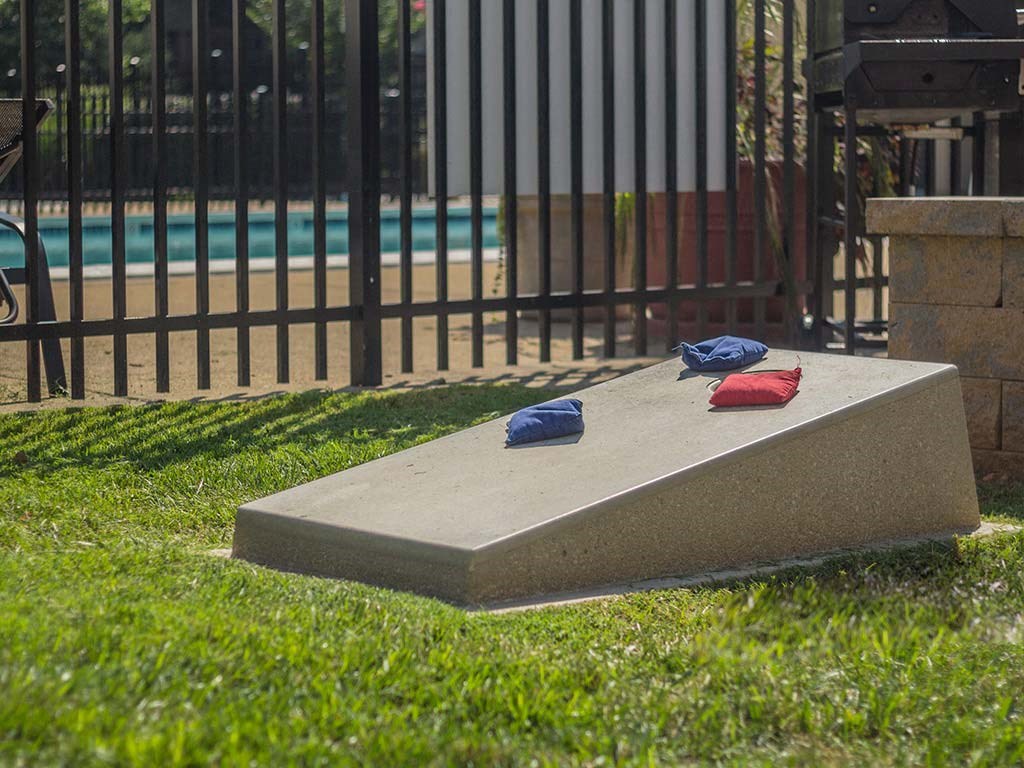 Cornhole area next to swimming pool at Tysons Glen Apartments and Townhomes, Falls Church, VA