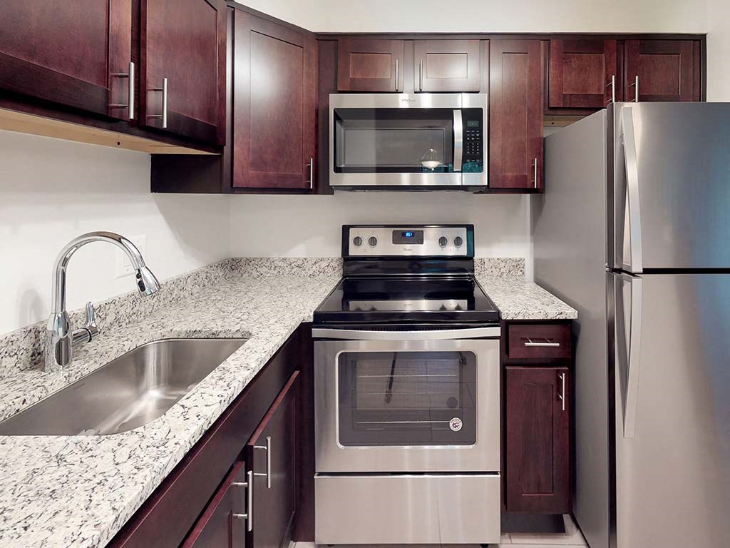 Granite counters in kitchen space in apartment unit at Tysons Glen Apartments and Townhomes, Falls Church
