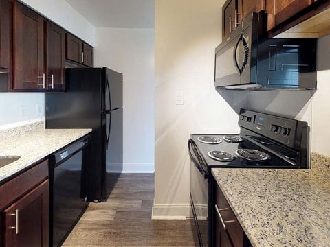 Kitchen area with granite counter tops in apartment unit at Gainsborough Court Apartments, Virginia, 22030