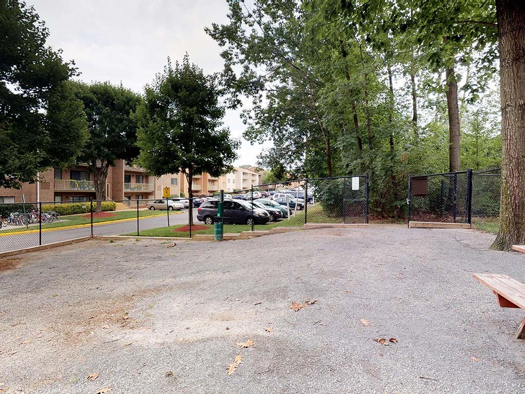 Outdoor park area for residents with benches at Gainsborough Court Apartments, Fairfax, Virginia