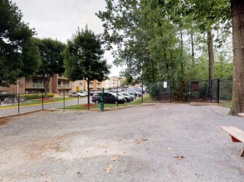 Outdoor park area for residents with benches at Gainsborough Court Apartments, Fairfax, Virginia - Photo Gallery 16