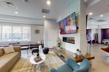 a living room with a couch and a fireplac at Rose Hill Apartments, Alexandria, VA, 22310