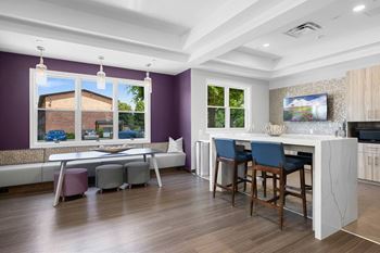 A kitchen with a bar area and a dining table at Rose Hill Apartments, Virginia, 22310