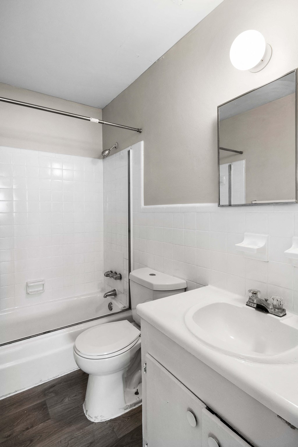 a bathroom with a sink toilet and a bath tub