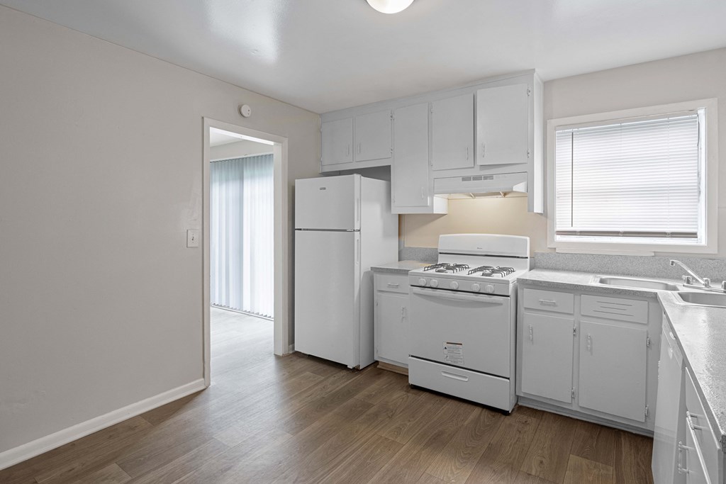 the preserve at ballantyne commons apartment kitchen with white appliances and white cabinets