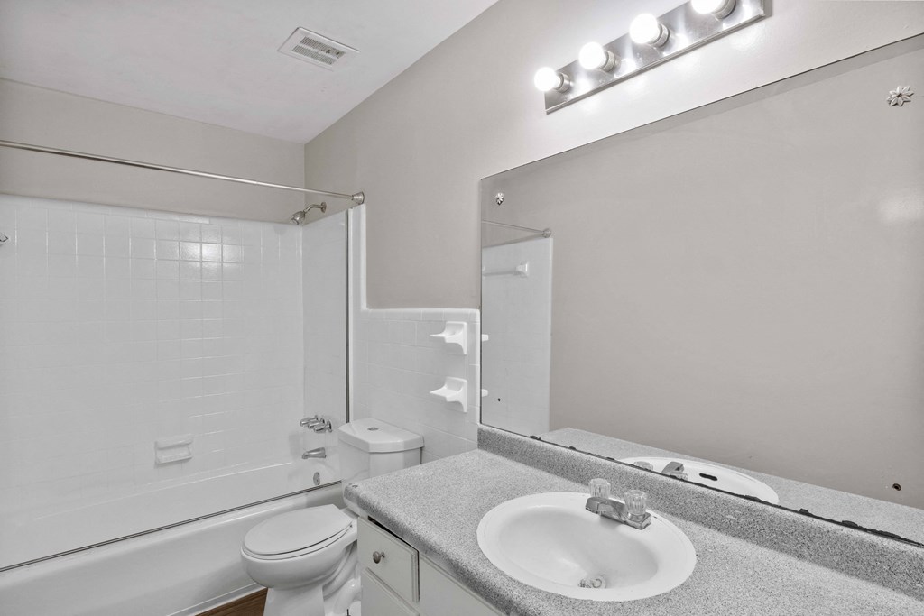 the preserve at ballantyne commons apartment bathroom with sink toilet and shower