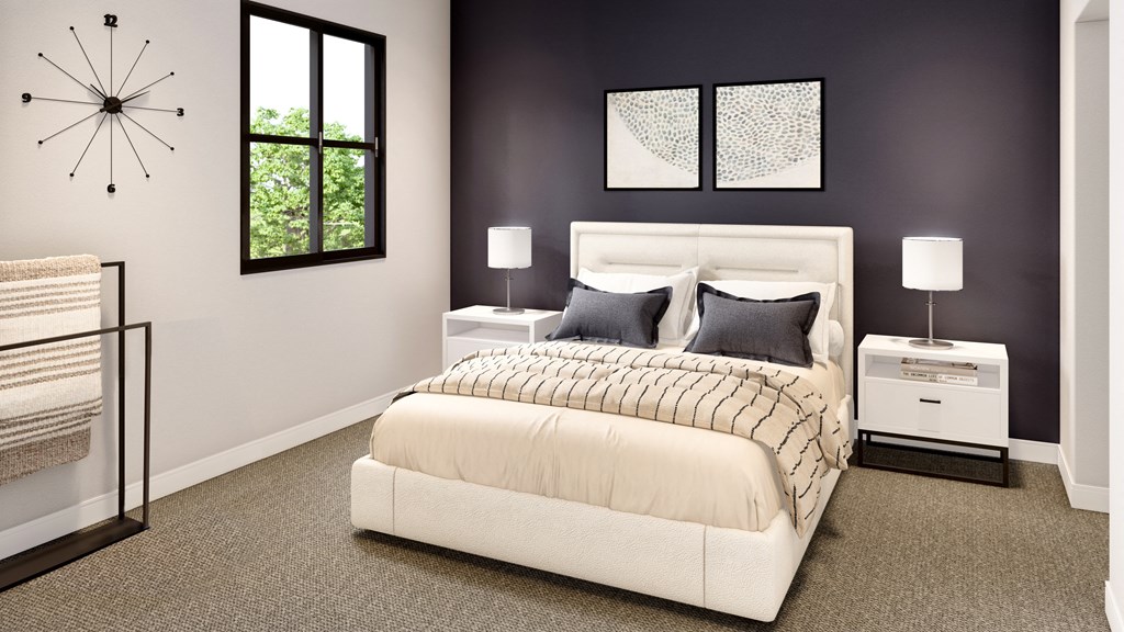 a bedroom with a bed and a clock on the wall