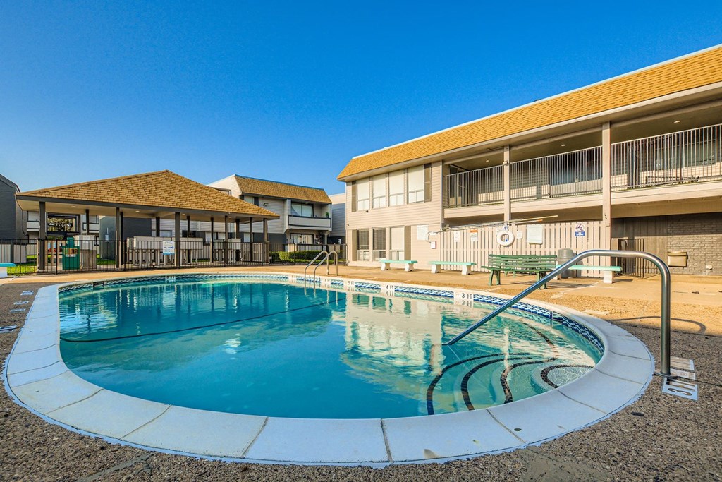 A round swimming pool with a ladder on the side.