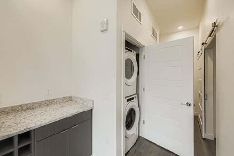 A laundry room with a washer and dryer in it.