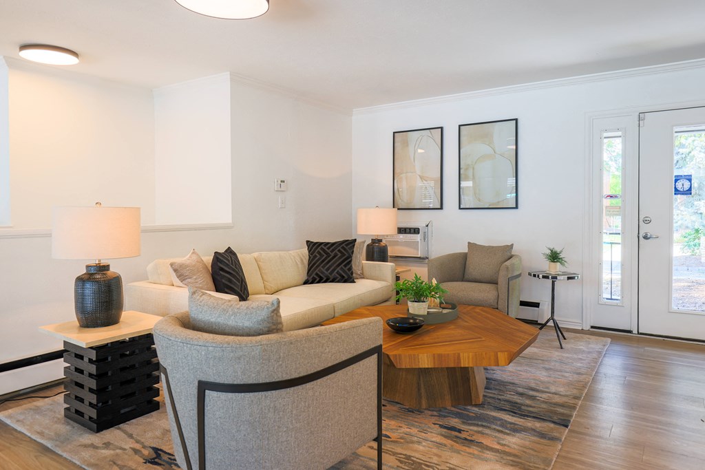 a living room with couches and chairs and a coffee table